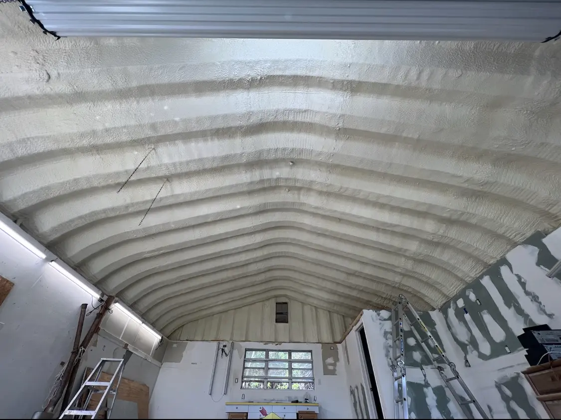 Spray polyurethane foam applied to the underside of a metal roof deck in Wayland